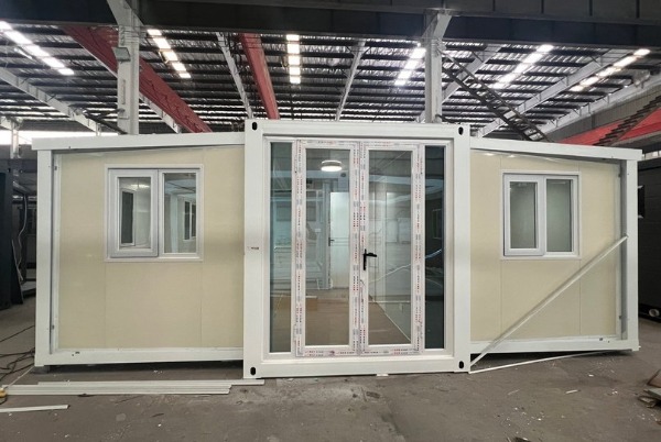 Expandable container house from China expanded on site &mdash; shipped as standard box, opens into self-contained living unit